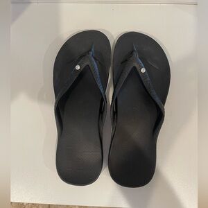 Archies black flip flops